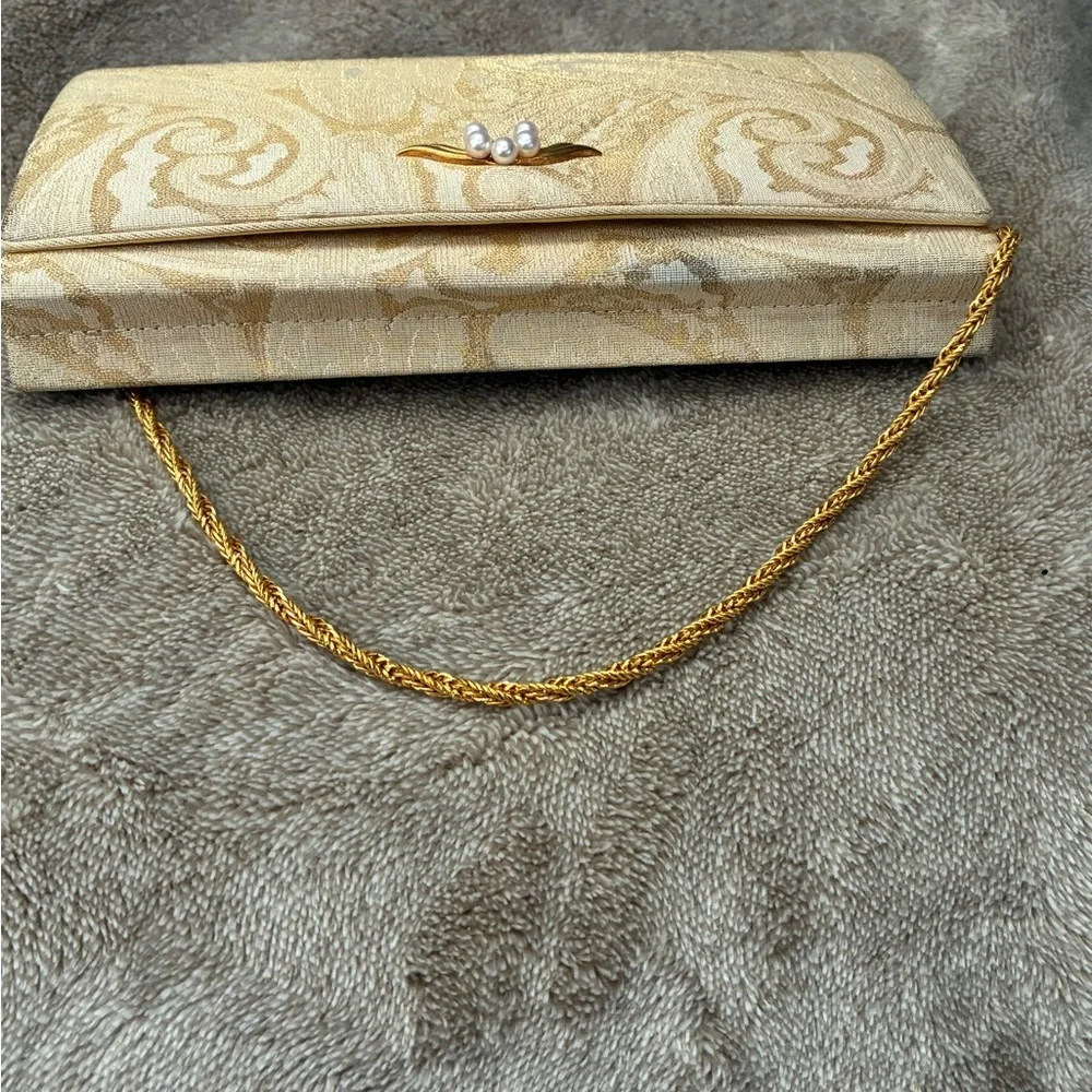 Mikimoto Cream Clutch with Gold Accents
